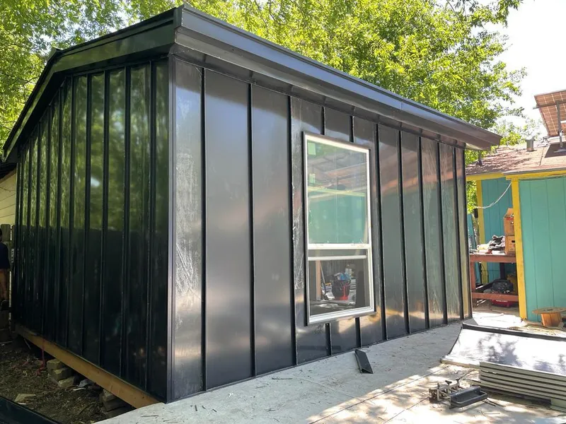 Black standing seam metal wall panels for Roof Inspection in Wolcott