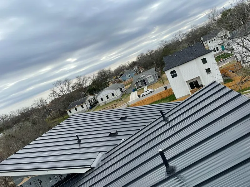 Standing seam metal roof panels with vents for Skylight Repair in Wolcott